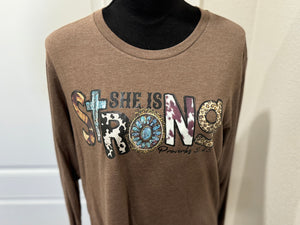 She is strong long sleeve graphic tee