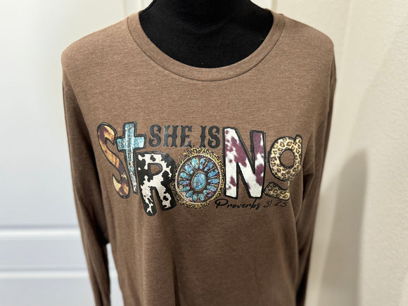 She is strong long sleeve graphic tee