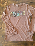 She is strong long sleeve graphic tee